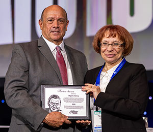 Tom Toner (left) presented the Benjamin F. Fairless Award for Distinguished Achievement in Iron and Steel Metallurgy to Olga A. Girina (right).