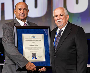 Tom Toner (left) presented the Distinguished Member and Fellow Award to Darrell E. Sturgill (right).